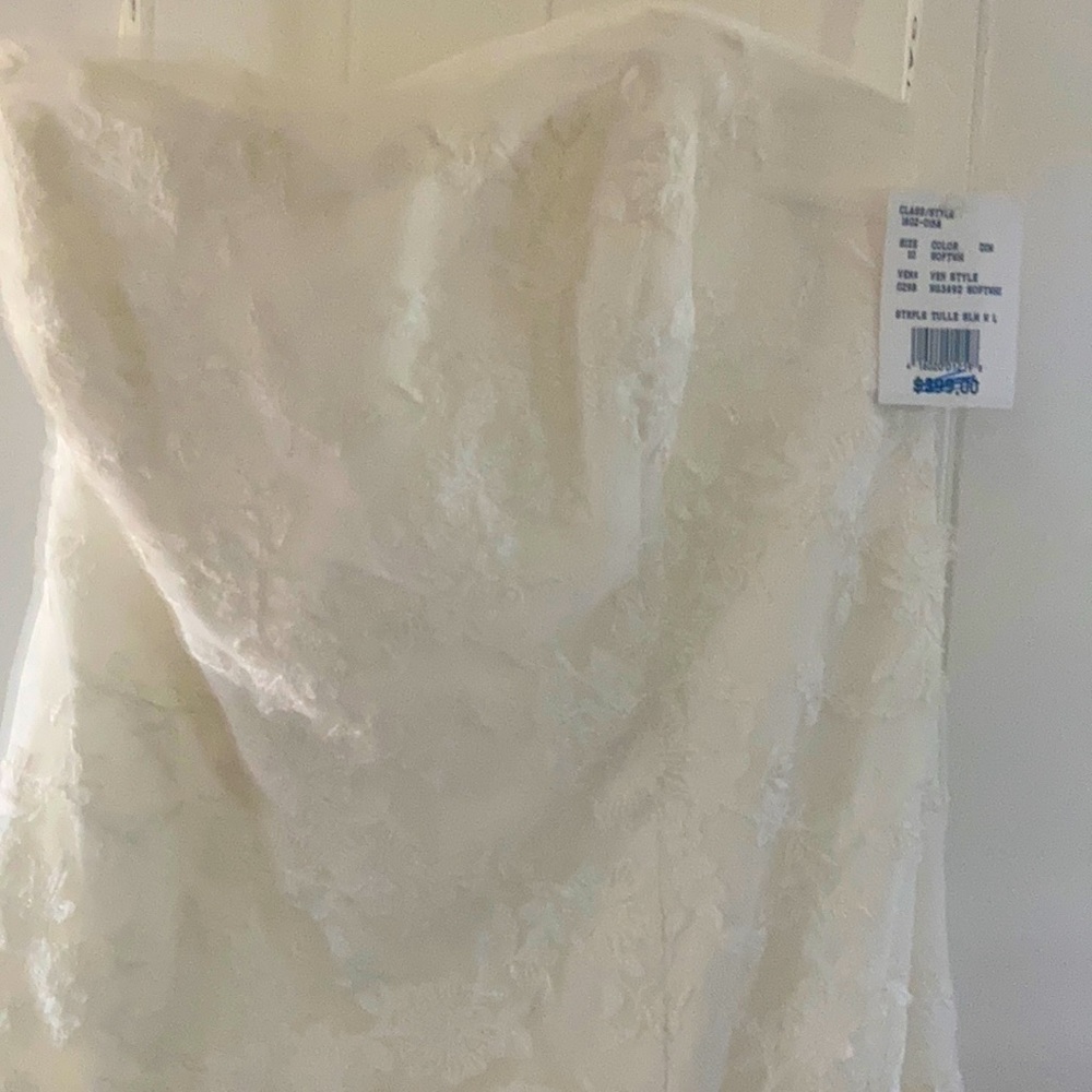 White wedding dress, size 10, strapless with the front short than the back.
